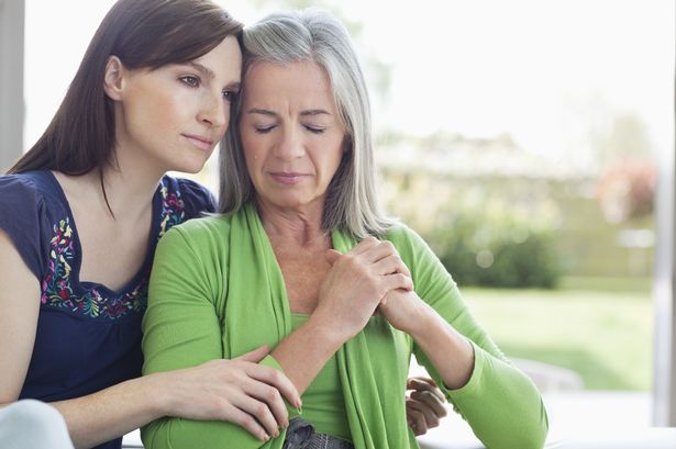 Woman consoling sad mother-1163082