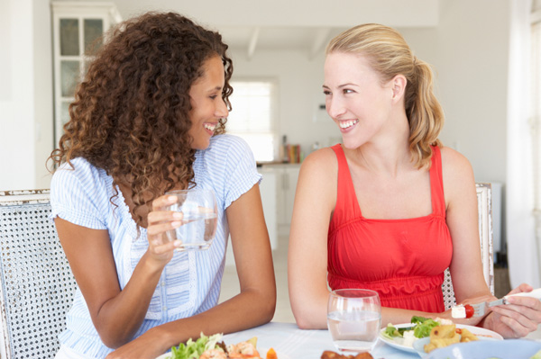 women-friends-having-lunch-at-home