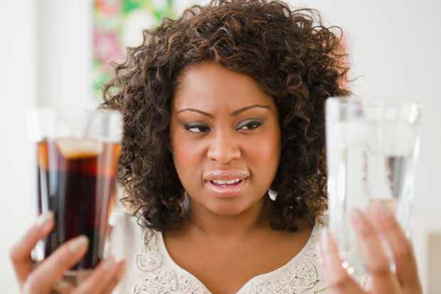 woman holding soda