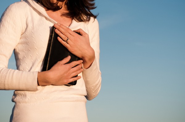 Woman_holding_bible-600x397