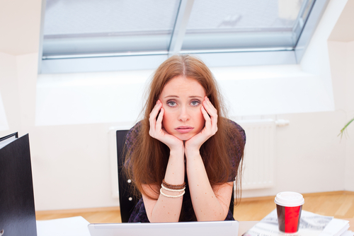 fed-up-woman-at-desk