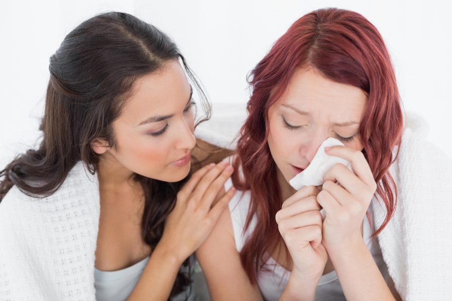 woman consoling woman