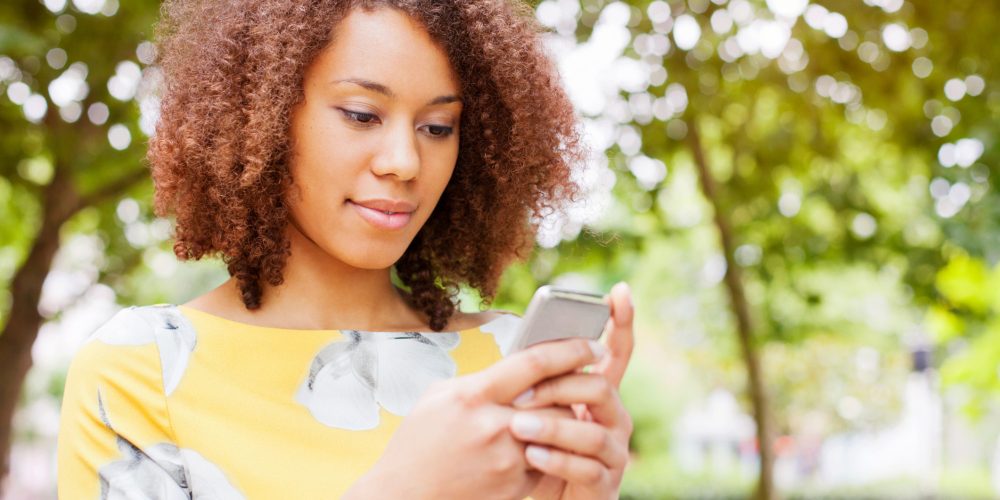 Young woman using smart phone