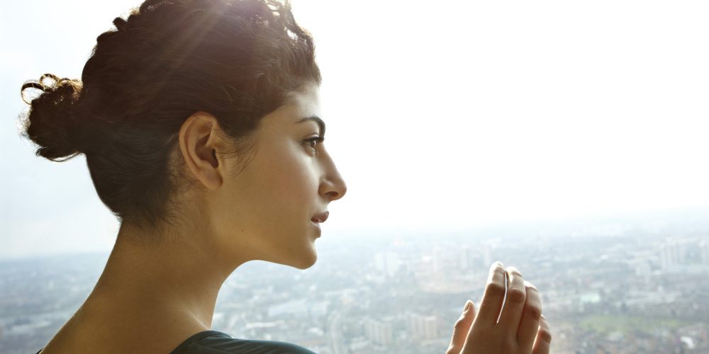 Girl looking down at the city