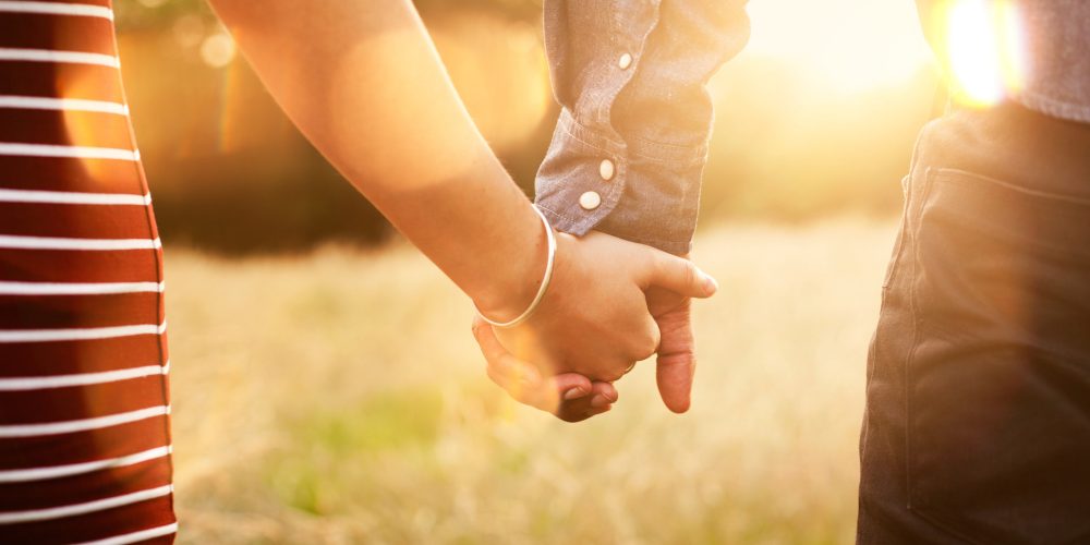 couple holding hands