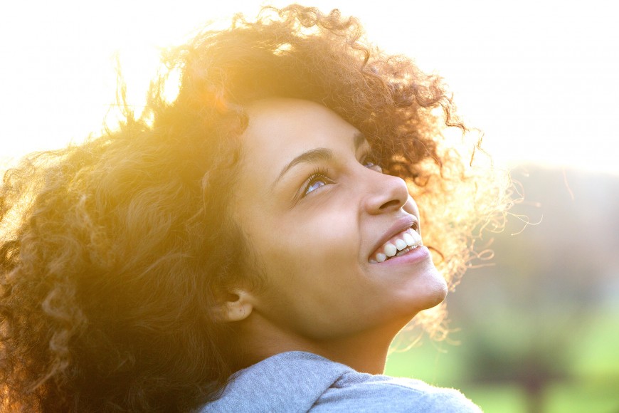 young woman looking at the sky